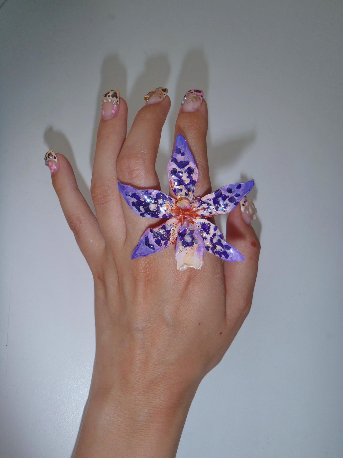 Tiger Orchid in purple ring